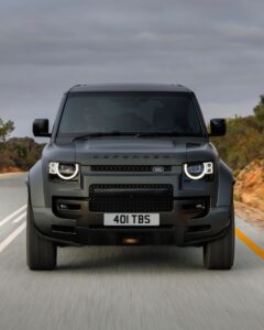 Black car wallpaper with neon city lights