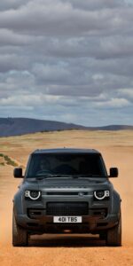 Black car wallpaper with city skyline