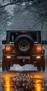 Black car wallpaper in rainy night city