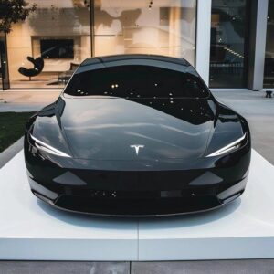 Tesla wallpaper with sunset sky and open road